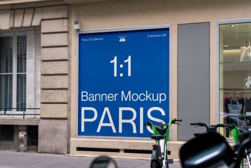 Outdoor banner mockup on shop facade in urban setting for designers to display branding, signage, and advertising designs.